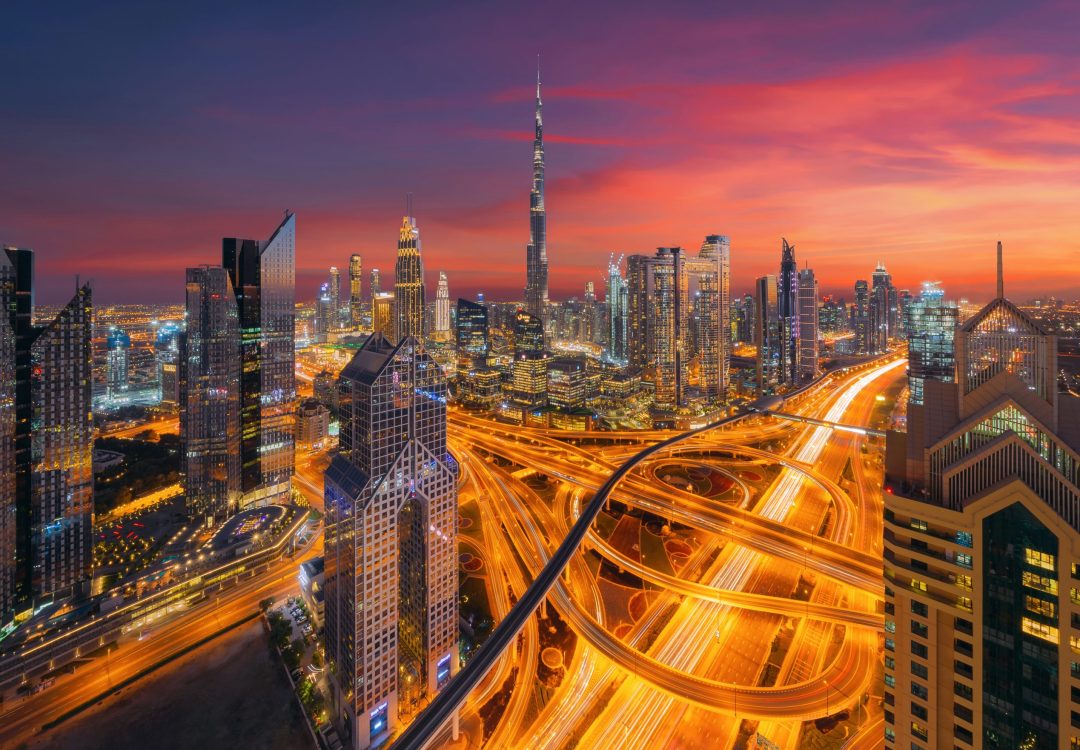 Aerial view of Burj Khalifa in Dubai Downtown skyline and highway, United Arab Emirates or UAE. Financial district and business area in smart urban city. Skyscraper and high-rise buildings at night. Aerial view of Burj Khalifa in Dubai Downtown skyline and highway, United Arab Emirates or UAE. Financial district and business area in smart urban city. Skyscraper and high-rise buildings at night.