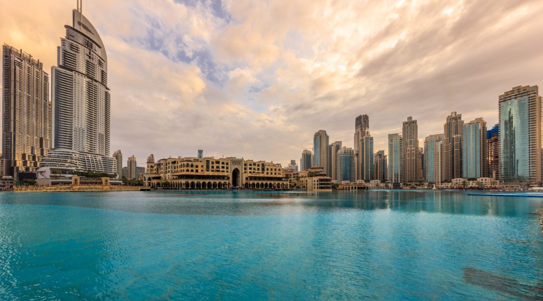 Dubai Marina canal and promenade. Cityscape with beautiful contemporary skyscrapers and bay.